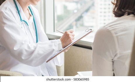 Doctor (gynecologist Or Psychiatrist) Consulting And Diagnostic Examining Woman Patient's Health In Medical Clinic Or Hospital Healthcare Service Center