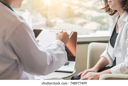 Doctor (gynecologist Or Psychiatrist) Consulting And Examining Woman Patient's Health In Medical Clinic Or Hospital Healthcare Service Center