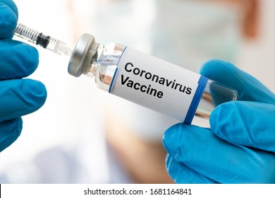 Doctor Hand In Gloves Holding Coronavirus Vaccine