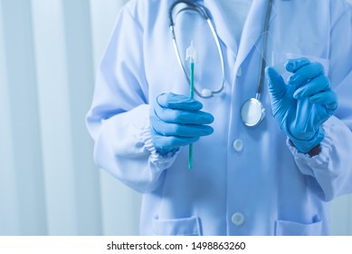 Doctor Hand Holding Cytobrush And Glass Slide Cytology Set.Gynecologist Working For Vaginal And Cervix Pap Smear Patient In The Obstetrics And Gynecology Department.Medical Concept.