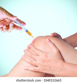 Doctor Hand Holding Syringe Of Platelet Rich Plasma For Injection To Knee.