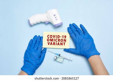 Doctor Hand Holds A Card With Text - New Covid Variant Omicron. Covid-19 New Variant - Omicron. Omicron Variant Of Coronavirus. SARS-CoV-2 Variant Of Concern