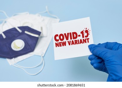 Doctor Hand Holds A Card With Text - New Covid Variant Omicron. Covid-19 New Variant - Omicron. Omicron Variant Of Coronavirus. SARS-CoV-2 Variant Of Concern