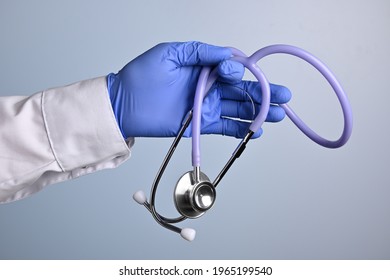 Doctor hand holds medical stethoscope. Standard medical gadget for photostocks and advertisement fake doctors. Physician accesories to demonstrate medical occupation. Device to diagnose heart noise.