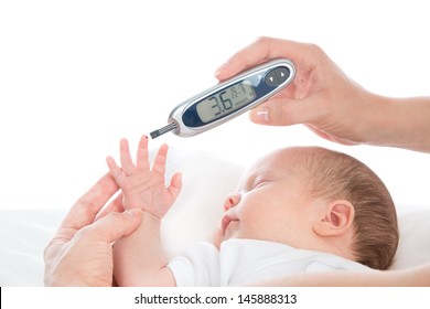 Doctor Hand Measuring Glucose Level Blood Chemistry Test From Diabetes Patient Child Baby Using Glucometer And Small Drop Of Blood From Finger And Test Strips Isolated On A White Background