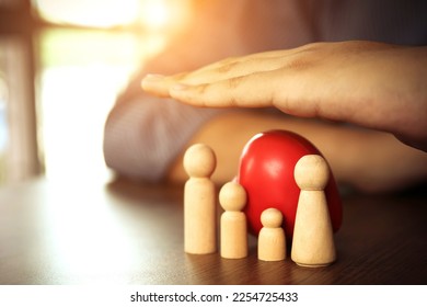 Doctor hand protect wooden doll concept of health care safety family insurance or health checkup or healthy planning or sick prevention. - Shutterstock ID 2254725433