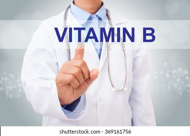 Doctor hand touching Vitamin B sign on virtual screen. medical concept