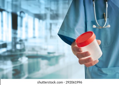 Doctor hand with urine container