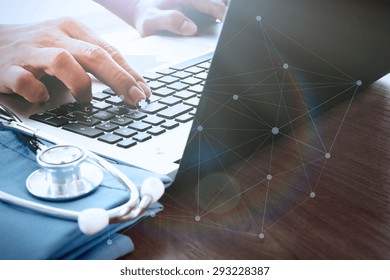 Doctor Hand Working With Laptop Computer In Medical Workspace Office As Concept With Social Media Diagram