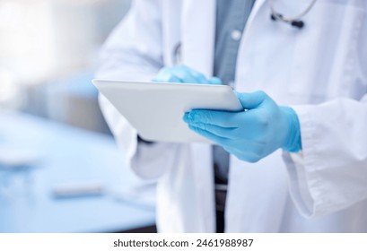 Doctor, hands and gloves with digital tablet for record keeping of patient in hospital with consulting. Healthcare, technology and research with people for innovation in medicine for medical analysis - Powered by Shutterstock