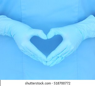 Doctor Hands In Gloves Making Heart Shape