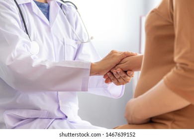 Doctor hands holding pregnant woman's hand during medical consultation, empathy and support while medical examination. - Shutterstock ID 1467639152