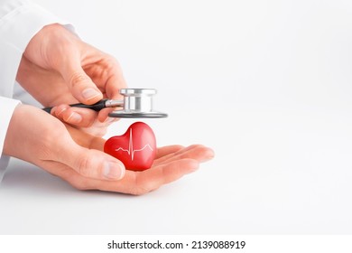 Doctor Hands Holding Red Heart And Stethoscope. Cardiology, Heart Health And Care, Health Day Concept. Copy Space.