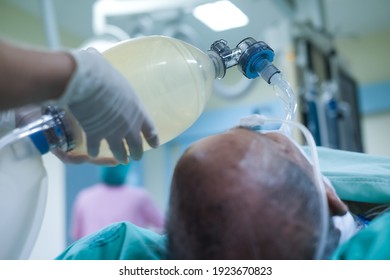 Doctor hands holding resuscitation bag. Medical team helping man who are not breathing with ambu bag in CPR , Cardiopulmonary resuscitation process. - Powered by Shutterstock