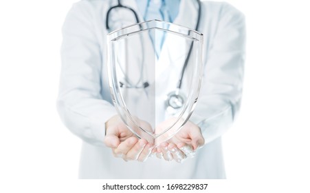 Doctor Hands Holding Shield On White Background For Medical Protection Concept.