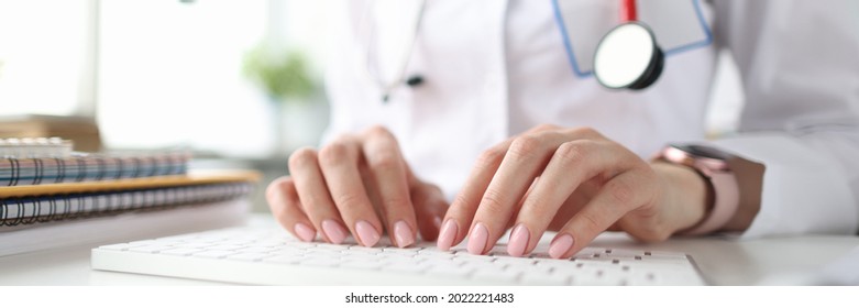 Doctor Hands On White Keyboard. Getting Medical Education