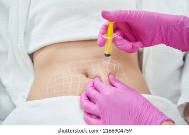 Doctor hands in pink gloves is doing anti cellulite reduction procedure - Shutterstock ID 2166904759