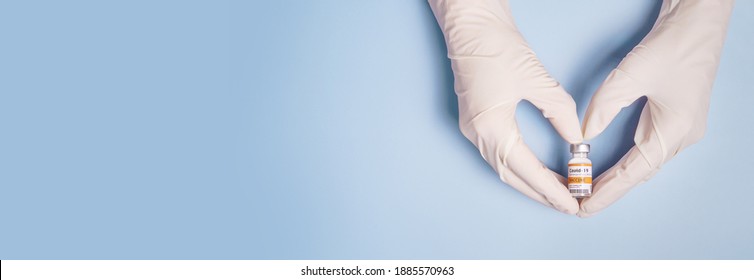 Doctor Hands in protective gloves holding Coronavirus 2019-nCoV Vaccine vial and gesture in heart shape. Successful, Hope, Good news, Support, Donation, Priority, Fight with Covid-19 pandemic. Banner. - Shutterstock ID 1885570963
