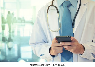 Doctor Hands Texting On A Smart Phone 