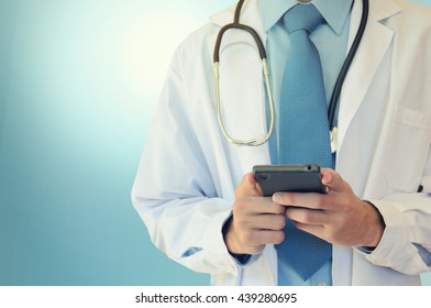 Doctor Hands Texting On A Smart Phone 