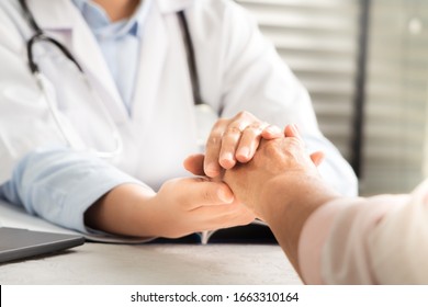 Doctor Hands Together Holding Senior Woman Patient