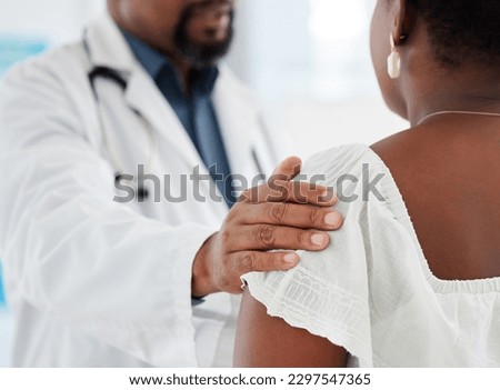 Doctor, hands and touch shoulder of patient for support, comfort and kindness. Healthcare, consultation and medical professional talking with black woman for empathy, bad news or cancer diagnosis.