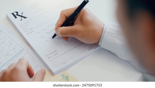 Doctor, hands and writing with document for prescription, dosage or information on medication above at hospital. Person in healthcare, employee filling in for and sick note at consultation at clinic - Powered by Shutterstock