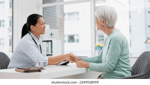 Doctor handshake, senior woman and healthcare with thank you in a hospital for medical care. Elderly consultation, smile and insurance conversation with women in a clinic office for retirement advice - Powered by Shutterstock