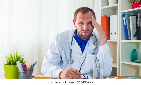 Doctor Having A Headache.