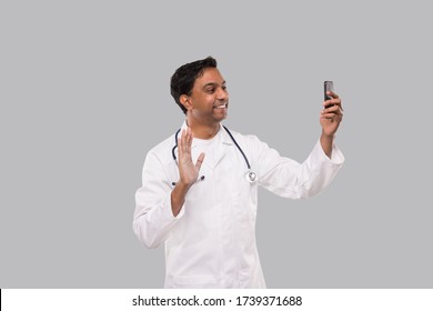 Doctor Having Video Call On Phone Isolated. Indian Man Doctor Video Call. Medicine Online. Doctor Using Phone.