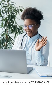 Doctor Having Videocall Online Video Chat With Patient Using Laptop Computer. African American Female Nurse Medical Assistant Enjoy Elearning Virtual Class. Telehealth, Telemedicine Or Remote Study