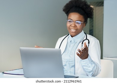 Doctor Having Videocall Online Video Chat. African American Young Female Physician Consulting Talking To Patient Looking At Laptop Computer Screen. Telehealth, Telemedicine And Technology Concept