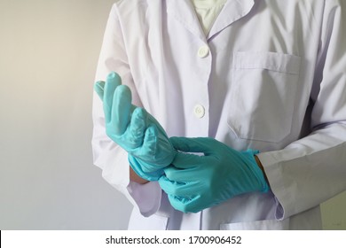 Doctor Or Health Professional Wearing Medical Grove. Hand Wearing Gloves. Medical Gloves. Surgical Glove. Hand With A Fist For Fighting Covid-19 Or Coronavirus. Medical Gloves. Surgical Glove.