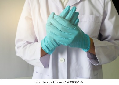 Doctor Or Health Professional Wearing Medical Grove. Hand Wearing Gloves. Medical Gloves. Surgical Glove. Hand With A Fist For Fighting Covid-19 Or Coronavirus. Medical Gloves. Surgical Glove.