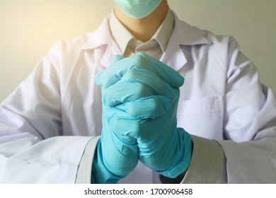 Doctor Or Health Professional Wearing Medical Grove. Hand Wearing Gloves. Medical Gloves. Surgical Glove. Hand With A Fist For Fighting Covid-19 Or Coronavirus. Medical Gloves. Surgical Glove.