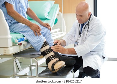 doctor helping to patient with prosthetic leg in the hospital - Shutterstock ID 2184265217