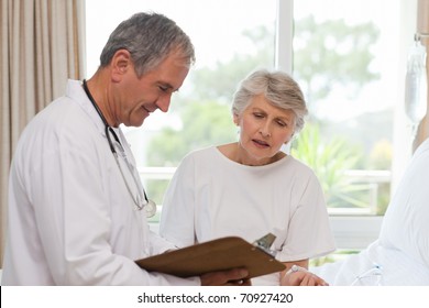 Doctor with his patient - Powered by Shutterstock