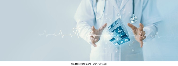 Doctor hold virtual cube medical on network with healthcare icons. Virus pandemic develop people awareness on healthcare and medical technology network enables wellness in patient healthcare. - Shutterstock ID 2047991036