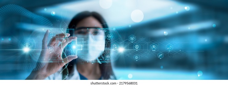 Doctor hold white cross of medical with healthcare icons on virtual interface network. Virus pandemic develop people awareness healthcare, Science, Medical technology and health care service.  - Shutterstock ID 2179568031