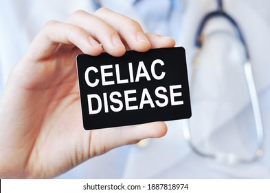 Doctor Holding A Black Paper Card With Text CELIAC DISEASE, Medical Concept. CELIAC DISEASE Card In Hands Of Medical Doctor