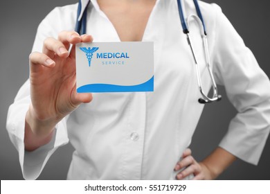 Doctor Holding Business Card, Closeup