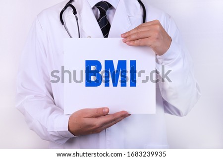Doctor holding a card with BMI medical concept