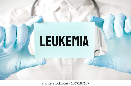 Doctor Holding Card In Hands And Pointing The Word LEUKEMIA