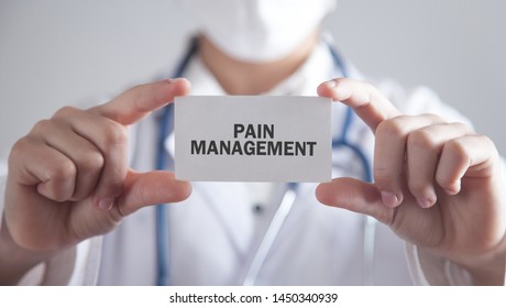 Doctor Holding Card. Pain Management