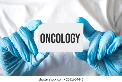 Doctor holding a card with text Oncology, medical concept - Shutterstock ID 2061634445