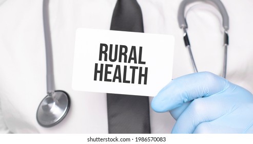 Doctor Holding A Card With Text Rural Health,medical Concept