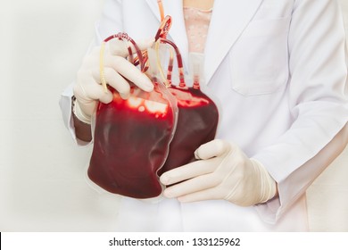 Doctor holding  fresh donor blood for transfusion