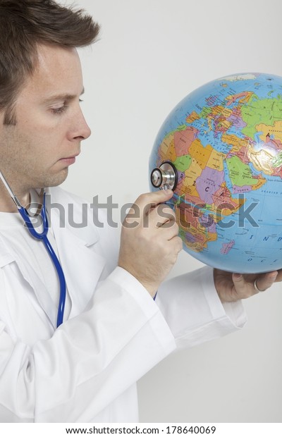 Doctor Holding Globe Stock Photo 178640069 | Shutterstock