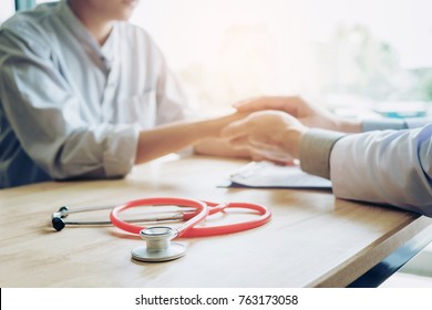 Doctor Holding Hands For Comforting And Care Patient