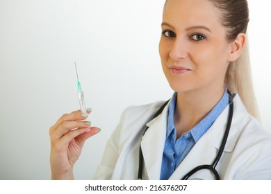 Sexy Nurse Holding Syringe On Blue Stock Photo (Edit Now) 160369745